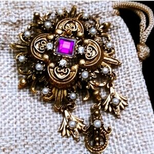 Ornate Gold and Purple Brooch with Filigree Design